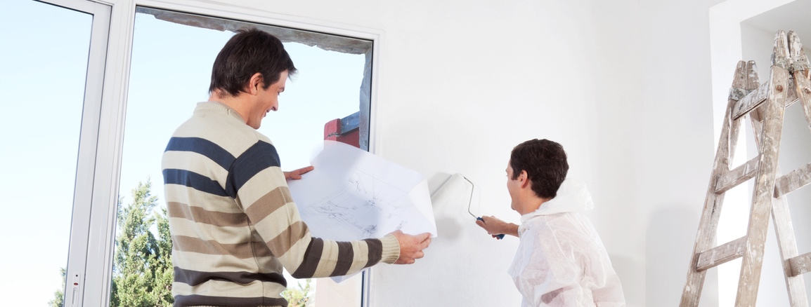 Man going through house plan.jpg